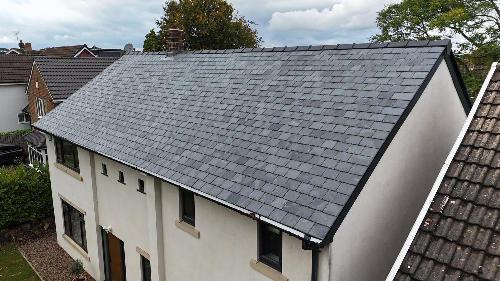 Completed slate roof on a British semi-detached house